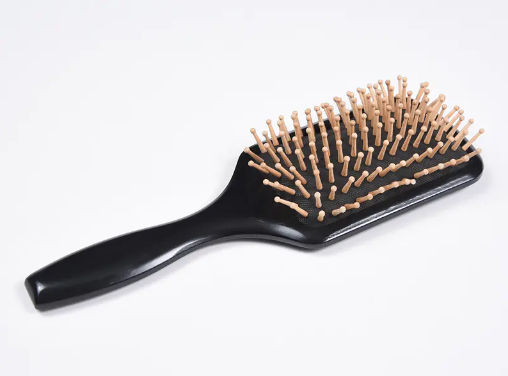 What are the best steps to use a detangling hair brush?